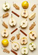 Arrangement of fresh quince, green apple, white currants and cinnamon sticks