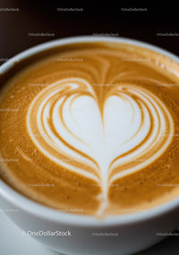 Close up of heart shaped latte art on coffee