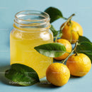 Refreshing Orange Juice in Glass Jar with Fresh Citrus Fruits