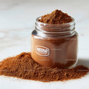 Glass Jar Filled with Fine Ground Coffee and Coffee Beans