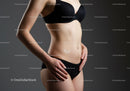 Toned Female Model in Black Lingerie Displaying Slim Waistline