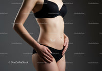 Toned Female Model in Black Lingerie Displaying Slim Waistline