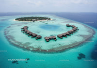 Tropical Island with Overwater Bungalows Surrounded by Clear Turquoise Water