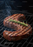 Juicy grilled T-bone steak with fresh rosemary herb