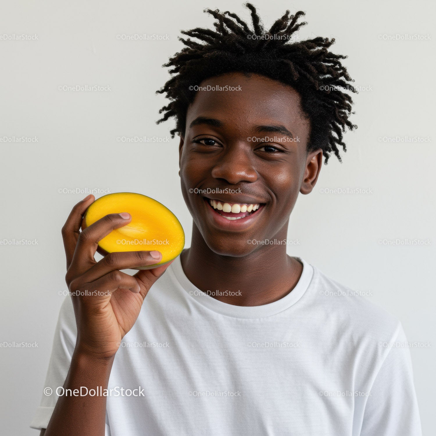Young Man with Dreadlocks Holding Yellow Mango Smiling Fast