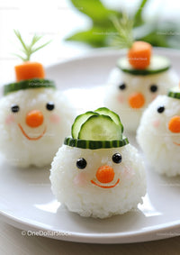 Whimsical Snowman Rice Balls with Cucumber Hat and Carrot Nose