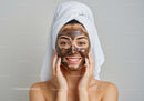 Young Woman Applying Facial Mask for Glowing Skin