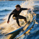 Focused surfer riding a sunlit ocean wave