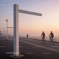 Cyclists and pedestrians on foggy seafront promenade