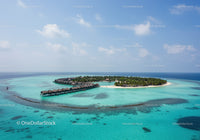 Tropical Island with Overwater Bungalows and Crystal Clear Waters