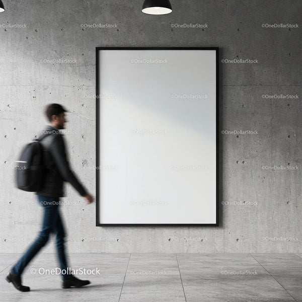 Young man walking past blank poster on concrete wall JPG Mockup Image