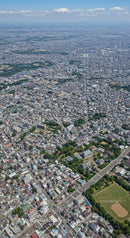Aerial View of a Busy Urban Cityscape with Skyscrapers and Green Parks