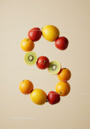 Fresh citrus and berries arranged in number six shape