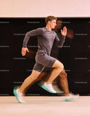 Athlete Sprinting Indoors with Motion Blur Effect
