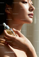 Close Up of Woman Applying Facial Serum to Skin