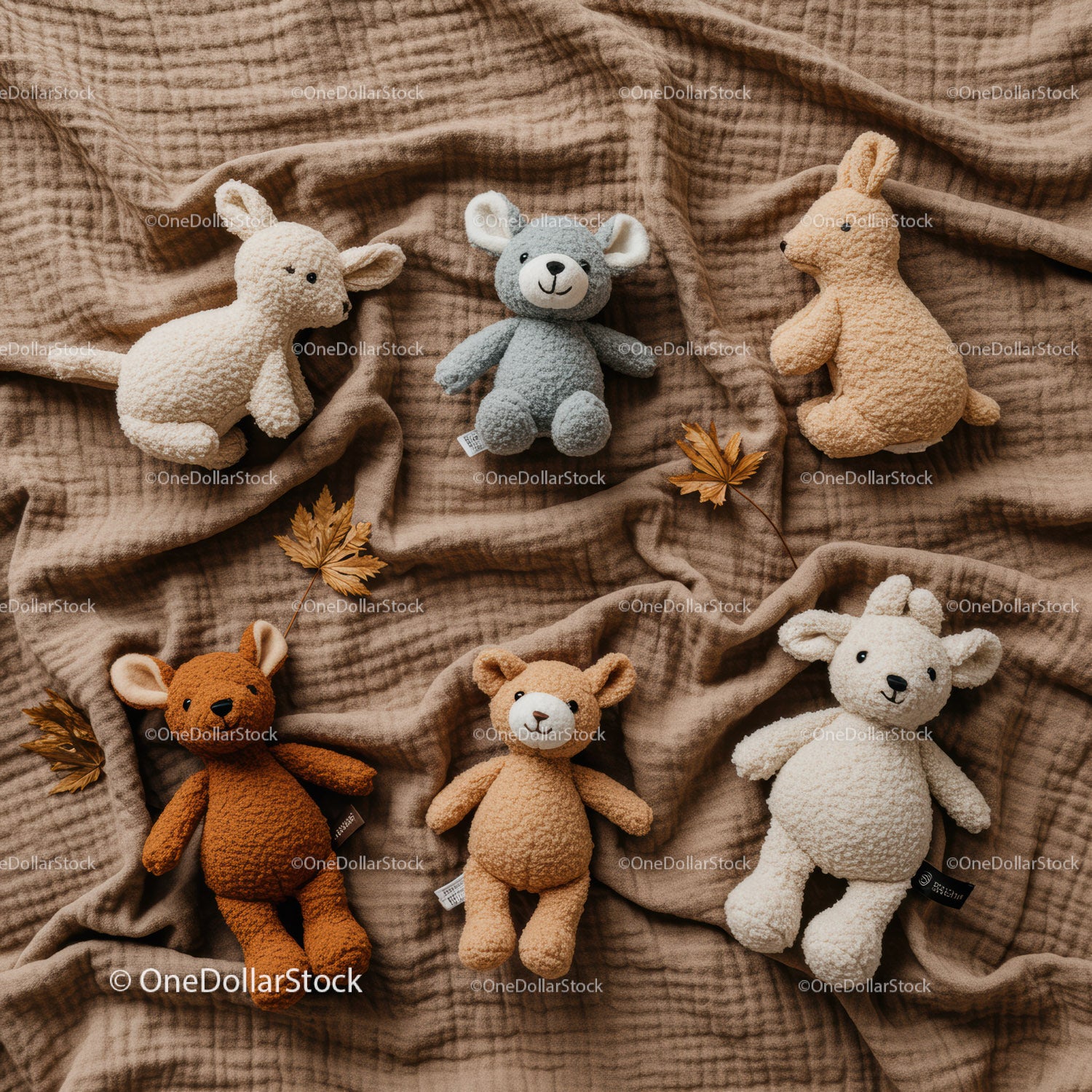 Soft Plush Animal Toys Arranged on Cozy Fabric Blanket