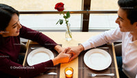 Couple Holding Hands During Romantic Dinner Date