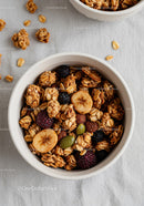 Close-up of granola with dried banana and berries in bowl