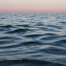 Calm Ocean with Gentle Waves at Sunset