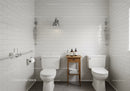 Modern Bathroom with White Tiles and Wooden Side Table