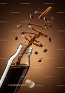Coffee Splash with Spices and Beans in Glass Bottle