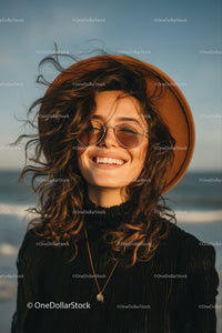 Happy Woman Wearing Straw Hat and Sunglasses at Beach During Sunset