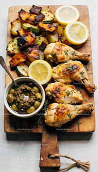 Grilled Chicken Drumsticks with Roasted Vegetables and Lemon