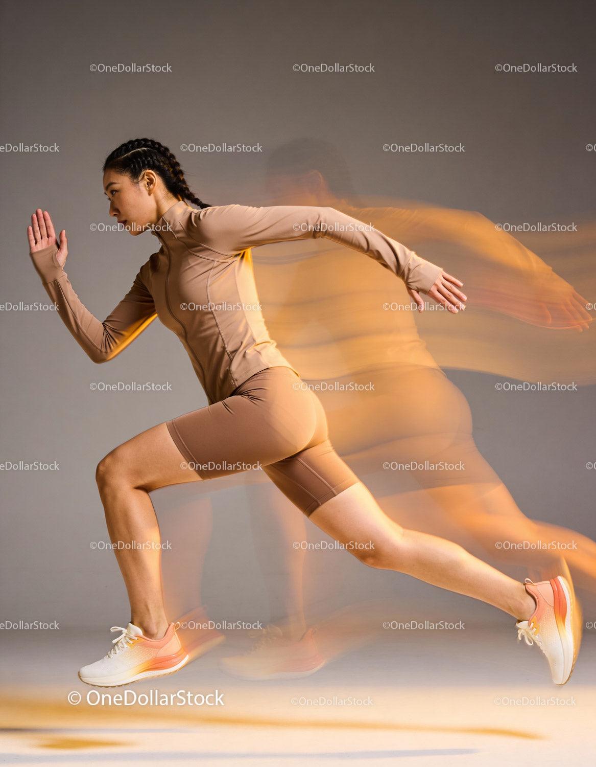 Athletic woman sprinting with motion blur effect