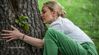 Joyful Woman Relaxing Outdoors in Natural Light