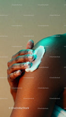 Close-up of hand moisturizing smooth skin on shoulder