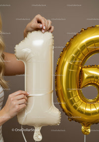 Woman Preparing Cream and Gold Number Balloons