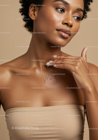 Beautiful Woman Applying Facial Moisturizer in Skincare Routine