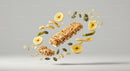 Crispy granola bar with banana chips and seeds floating