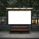 Empty street bench under illuminated blank billboard at dusk