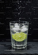 Refreshing sparkling water with lime and ice cubes