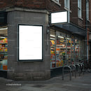 Urban corner store with illuminated blank advertising signs
