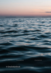 Serene Ocean Sunset with Gentle Ripples and Pastel Sky