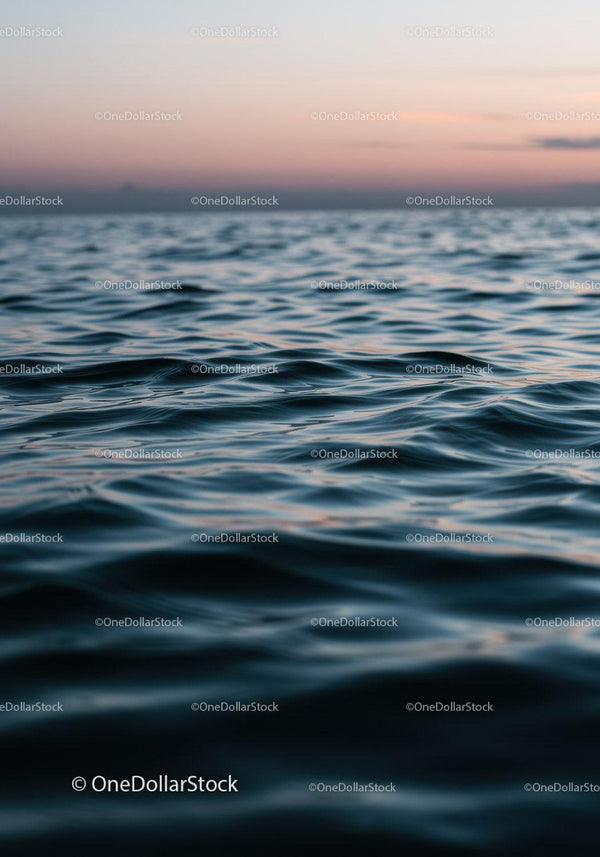 Serene Ocean Sunset with Gentle Ripples and Pastel Sky