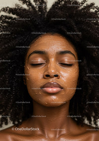 Youthful Woman Relaxing with Face Mask for Beautiful Skin