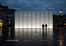 Modern Urban Lighting Wall with Silhouettes in City Night Scene