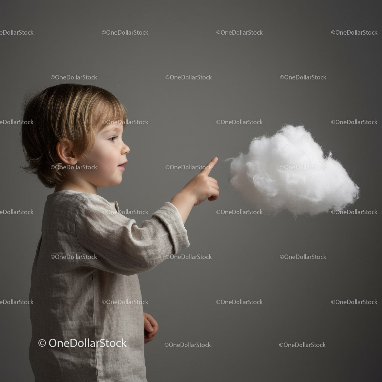 Toddler curious about fluffy cotton cloud indoors