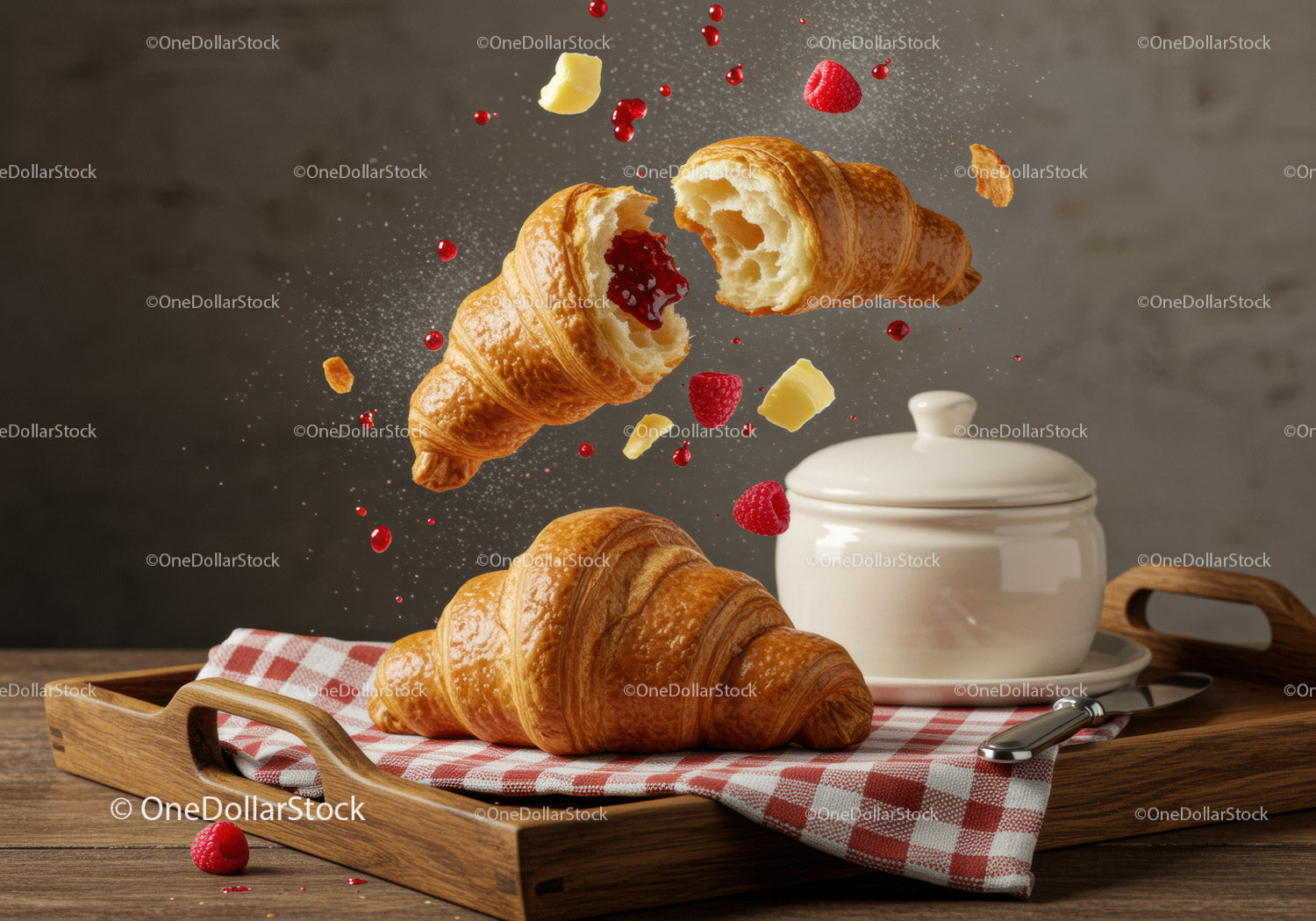 Fresh croissants with raspberry jam and butter on tray