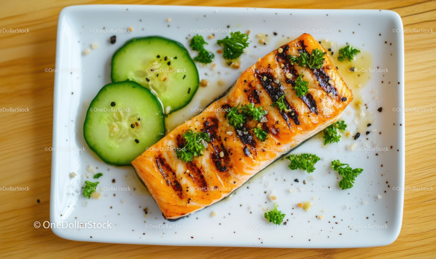 Grilled Salmon with Cucumber and Fresh Parsley on White Plate