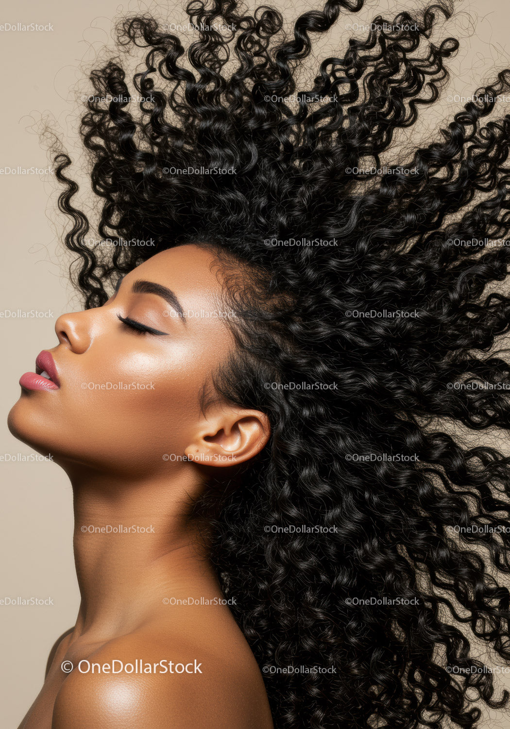 Profile of serene woman with voluminous curly hair