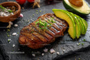 Juicy Grilled Steak with Fresh Avocado Slices on Slate Plate