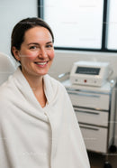 Happy Woman Sitting in Dental Clinic with Bright Smile and Relaxed Expression