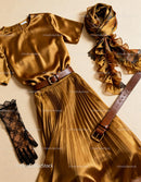 Elegant golden satin dress with accessories flat lay