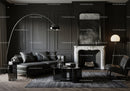 Modern living room with dark sofa and marble fireplace