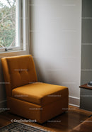 Orange Armchair in Cozy Minimalist Interior with Natural Light