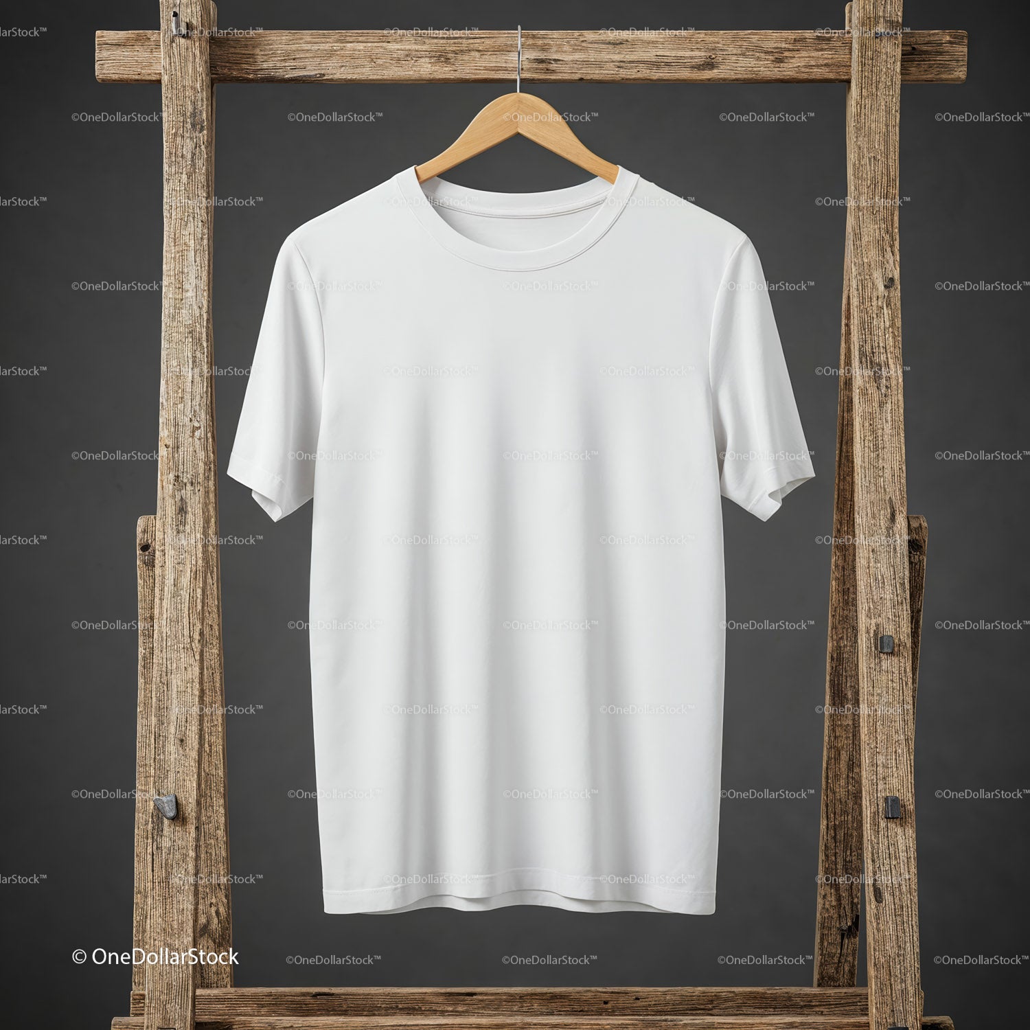 Plain white t shirt hanging on rustic wooden rack